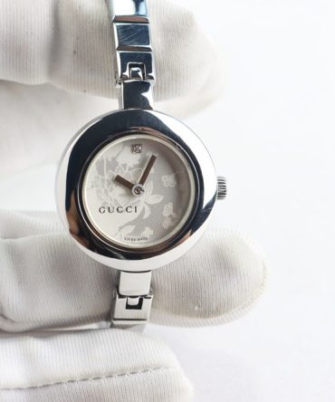 Đồng hồ nữ Gucci kiểu lắc 2 kim mặt hoa đính 1v kim cương thép nguyên chiếc